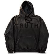 A black acid-wash pullover hoodie with 'TRUTH' printed in black across the chest, displayed on a clean white background.