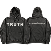 Two views of a washed black pullover hoodie on a plain white background. The front view shows the word 'TRUTH' printed in large white block letters across the chest, and the back view shows 'CONSEQUENCE' in white block letters with a small white flower icon replacing the 'O'.