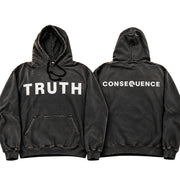 Two views of a washed black pullover hoodie on a white background. The front view shows the word 'TRUTH' printed in distressed white capital letters across the chest, and the back view shows 'CONSEQUENCE' in a similar white distressed font.